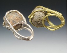 Twig ring with caged beachstone