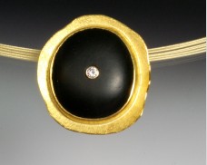 Concave disc pendant with basalt