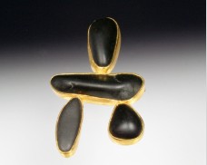 Four-stone basalt brooch