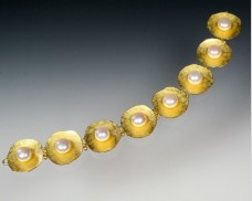 22K concave disc bracelet with pearls