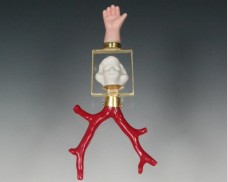 Girl, hand and coral pendant