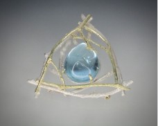 Nest brooch with gemstone